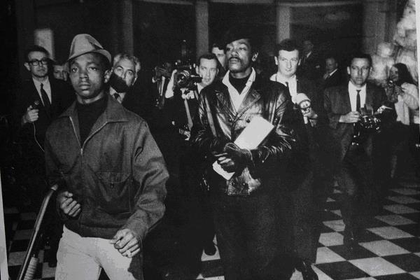 Bobby Hutton and Bobby Seale of the Black Panther Party, walking into the California state capitol to protest the Mulford Act. In April 1968, Bobby Hutton was shot by police officers, which helped spark mass awareness of the Panthers.